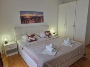 Postel nebo postele na pokoji v ubytování Apartment Rita