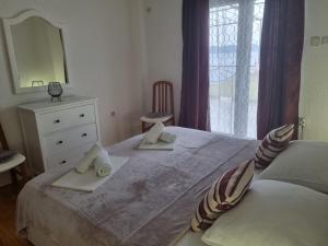 Postel nebo postele na pokoji v ubytování Apartment Rita