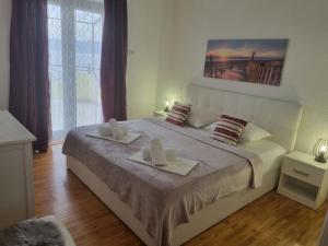 Postel nebo postele na pokoji v ubytování Apartment Rita