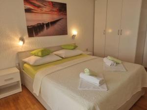 Postel nebo postele na pokoji v ubytování Apartment Rita