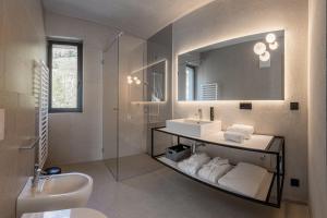 a bathroom with a sink and a mirror at Marchegg Apartments in Naturno
