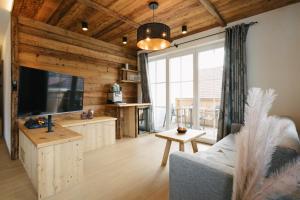 TV a/nebo společenská místnost v ubytování SunApart by Apart4you
