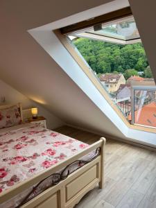 a bedroom with a bed and a large window at KronSoul in Braşov