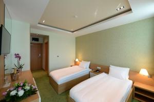 Voodi või voodid majutusasutuse Hotel Hedonic toas