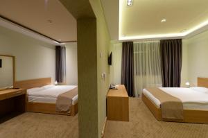 Voodi või voodid majutusasutuse Hotel Hedonic toas