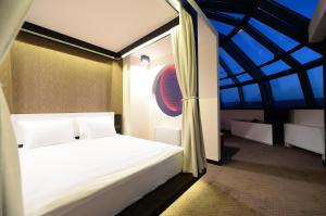 Voodi või voodid majutusasutuse Hotel Hedonic toas