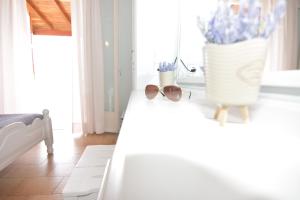 A bed or beds in a room at Baracunda Apartments