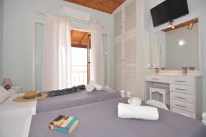 A bed or beds in a room at Baracunda Apartments