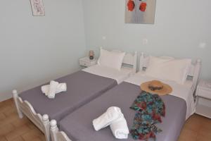 A bed or beds in a room at Baracunda Apartments