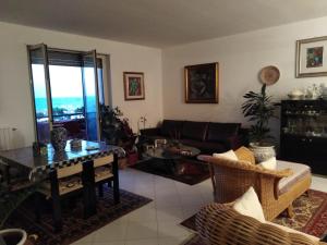 a living room with a couch and a table at Maria del Mar in Monopoli