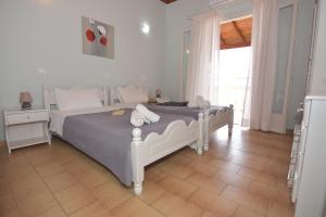 A bed or beds in a room at Baracunda Apartments