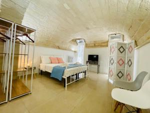 A bed or beds in a room at B&B Pietramare