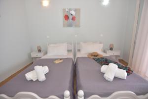 A bed or beds in a room at Baracunda Apartments