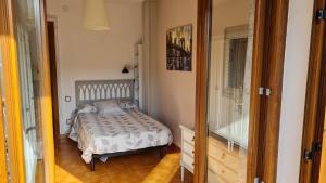 Postel nebo postele na pokoji v ubytování Apartament Vent de Port