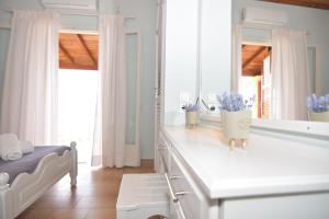 A bed or beds in a room at Baracunda Apartments