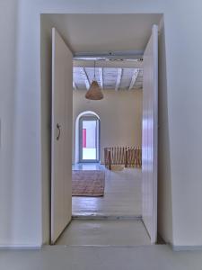 an open door to a room with a hallway at Flair Naousa in Naousa