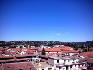a view of a city with roofs and buildings at Ibis Budget Bourgoin Jallieu Centre in Bourgoin