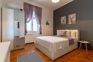 Ліжко або ліжка в номері Apartment Martini - Bacvice beach