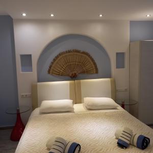 A bed or beds in a room at Naxos Blue Sky