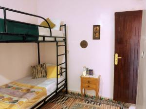 Postel nebo postele na pokoji v ubytování Vibe Surf Morocco