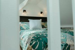 Posteľ alebo postele v izbe v ubytovaní La Villetta SPA -logement atypique