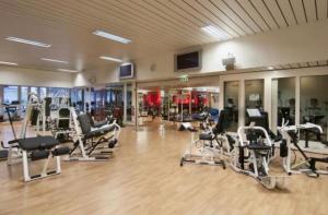 a gym with a bunch of treadmills and machines at Studio in Zurich