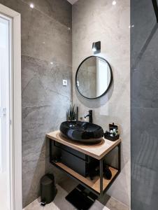 a bathroom with a sink and a mirror at Beyond Breathtaking Modern Residence Sir. Perfect in Dubrovnik