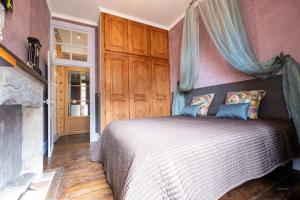 Кровать или кровати в номере La Suite des Consuls
