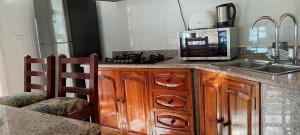 Kuchyň nebo kuchyňský kout v ubytování SAVY'S PLACE + 33 fotografií