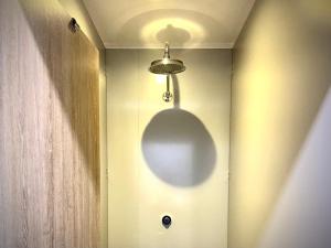 a light hanging from a wall in a room at Inversnaid Bunkhouse in Inversnaid