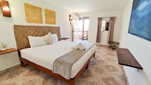 Cama o camas de una habitación en Blatha Tropical Rooms Holbox