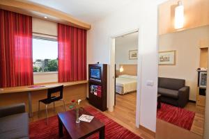 Postel nebo postele na pokoji v ubytování Hotel Rafael