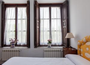 Postel nebo postele na pokoji v ubytování La Villa del Pantano