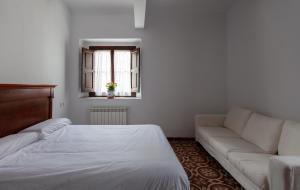 Postel nebo postele na pokoji v ubytování La Villa del Pantano