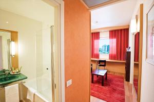 TV a/nebo společenská místnost v ubytování Hotel Rafael