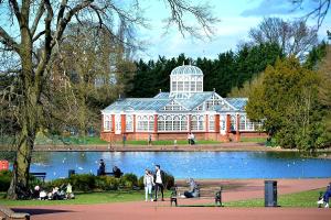 a large building with a pond in front of it at West Park Annex - Central Wolverhampton in Wolverhampton
