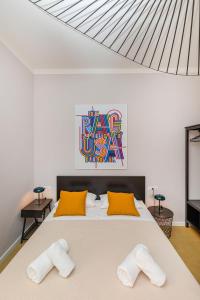 Postel nebo postele na pokoji v ubytování Cap Rooms + 9 fotografií