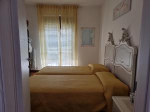 Łóżko lub łóżka w pokoju w obiekcie Mary House