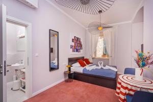 Postel nebo postele na pokoji v ubytování Cap Rooms