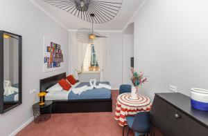 Postel nebo postele na pokoji v ubytování Cap Rooms