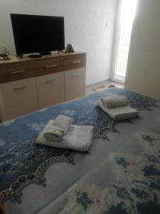 Säng eller sängar i ett rum på Apartman NECA Zlatar