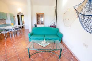 A seating area at DOMUS MAIORI LT - PMS CaseVacanze
