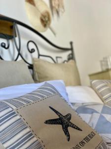 a starfish on a box on a bed at RODI BLUE appartments in Amoudara Herakliou