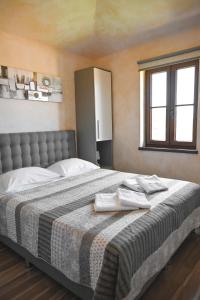 Posteľ alebo postele v izbe v ubytovaní Teo Apartments