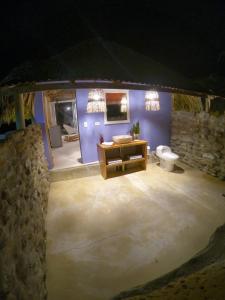 a bathroom with a sink and a toilet in a room at Portoalegre del hamaquero in Puerto Escondido