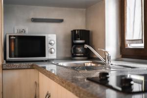Kuchyňa alebo kuchynka v ubytovaní Teo Apartments