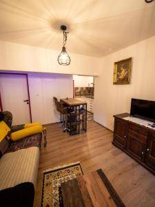 a living room with a couch and a table at Arabeska Majeli in Rukavac +4 photos
