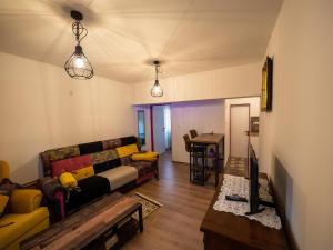 a living room with a couch and a table at Arabeska Majeli in Rukavac