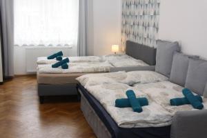A bed or beds in a room at Central Prague Wenceslas Square Apartments