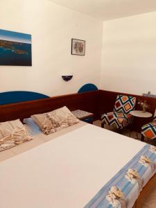 Postel nebo postele na pokoji v ubytování FUNTANA-MIA ROOMS B&B